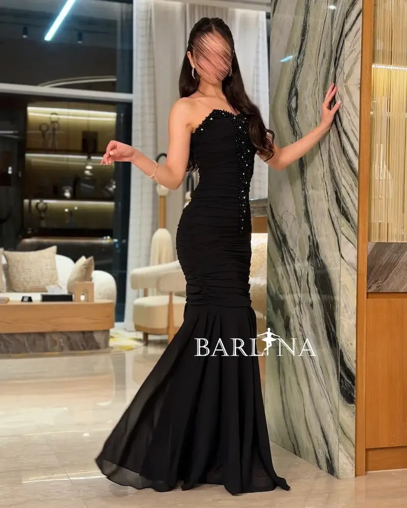 Black ruffled dress with crystal embroidery