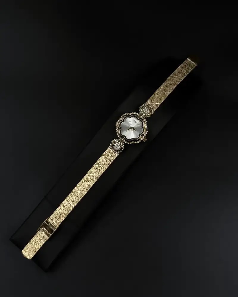 A delicate women's watch with an elegant floral design