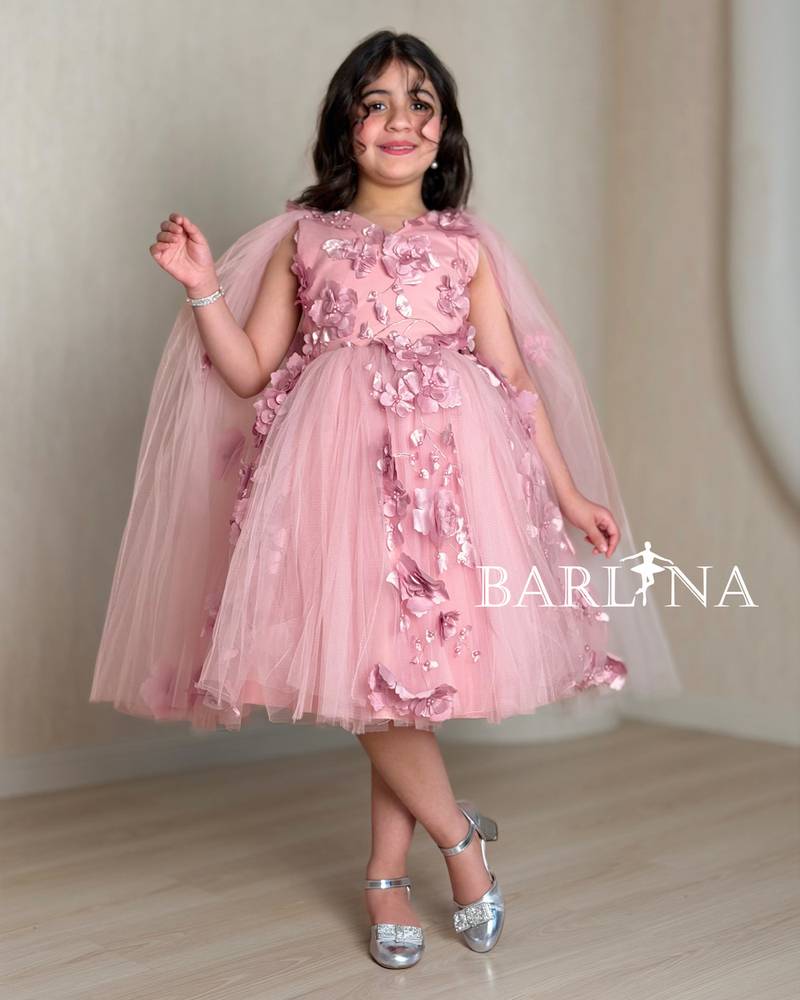Pink girl's dress with rose details and tulle layers