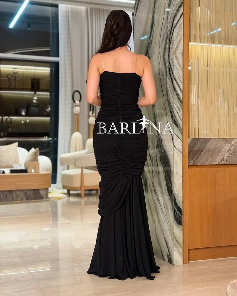 Black ruffled dress with crystal embroidery