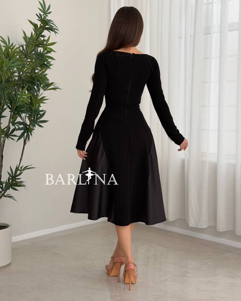 A simple black midi dress with a square neckline