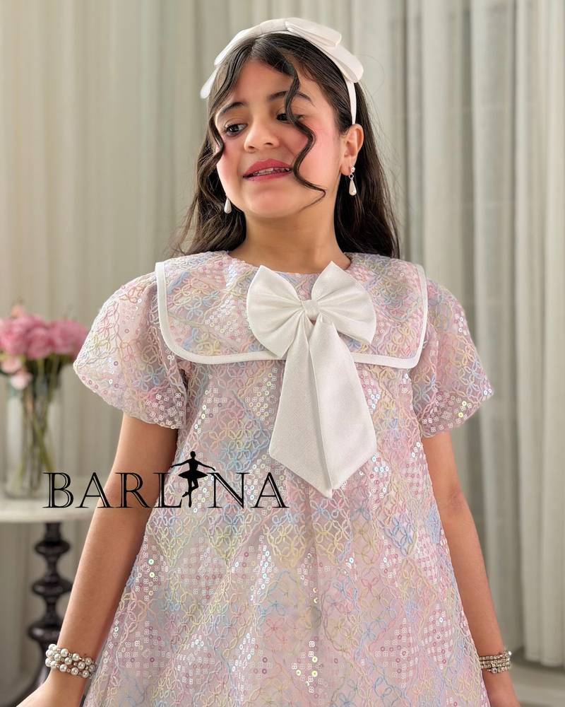 Pink girl's dress with a bow-decorated collar