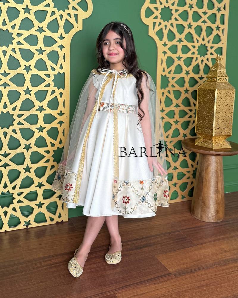 Off-white girls' dress decorated with oriental embroidery
