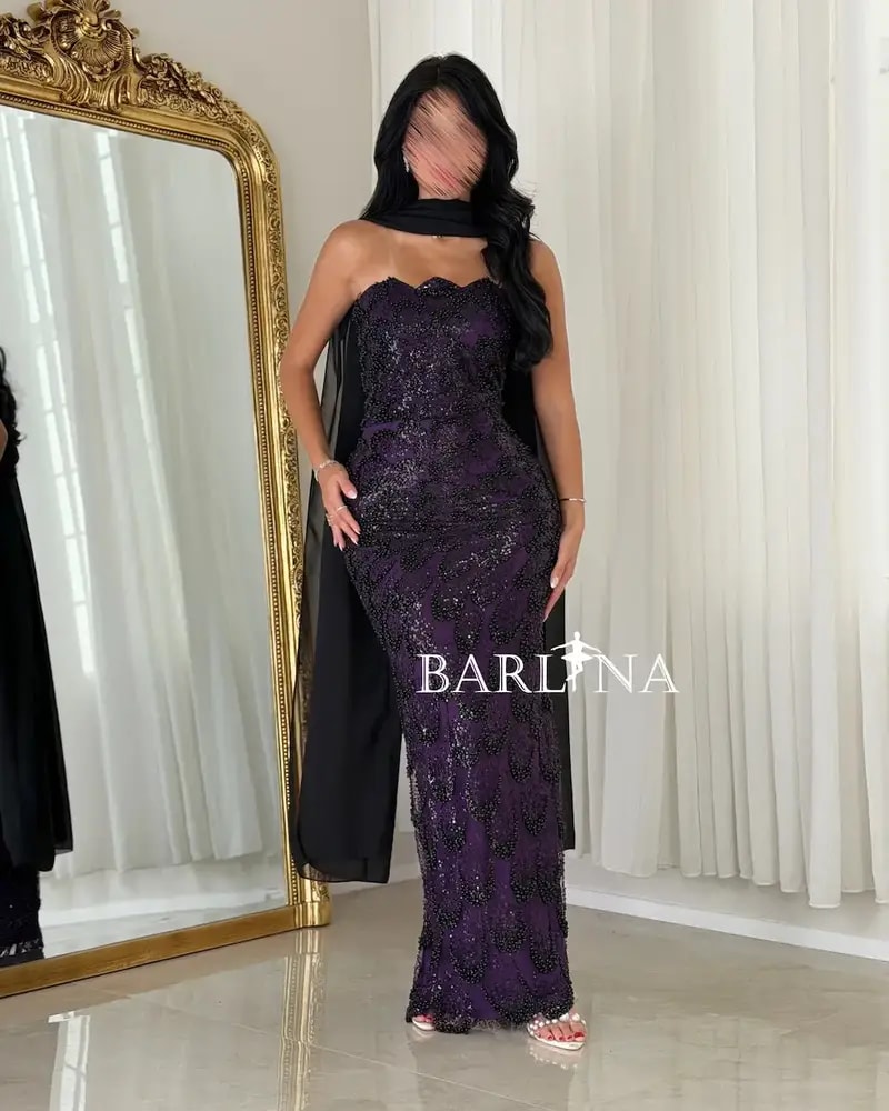 A purple embroidered dress with an elegant shawl