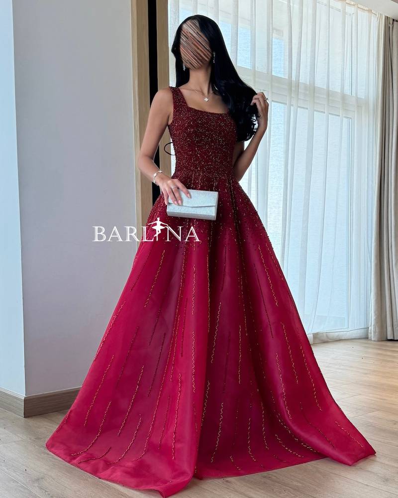Burgundy evening dress embroidered with shiny beads