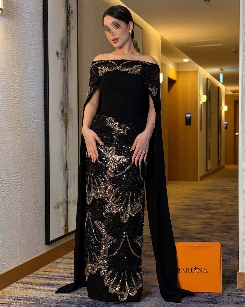فستان سهرة أسود بتطريز ذهبي فاخر