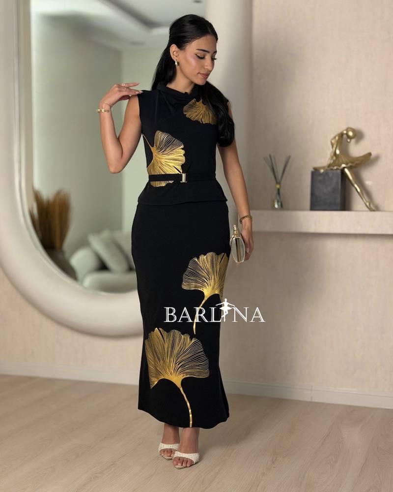 Black set decorated with a gold leaf pattern