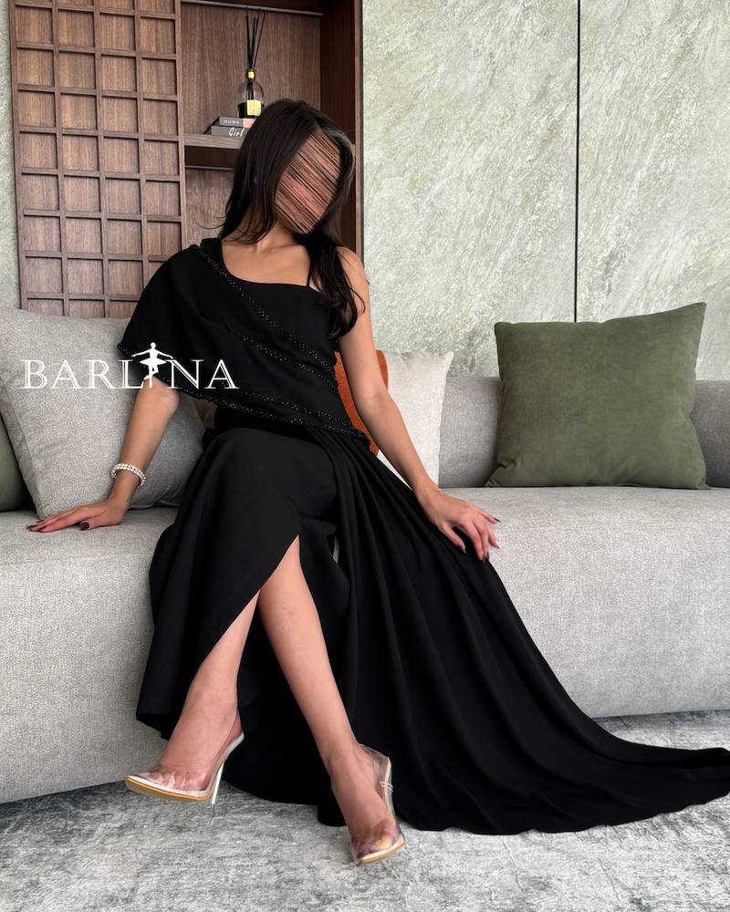 Black off shoulder dress embroidered with stones