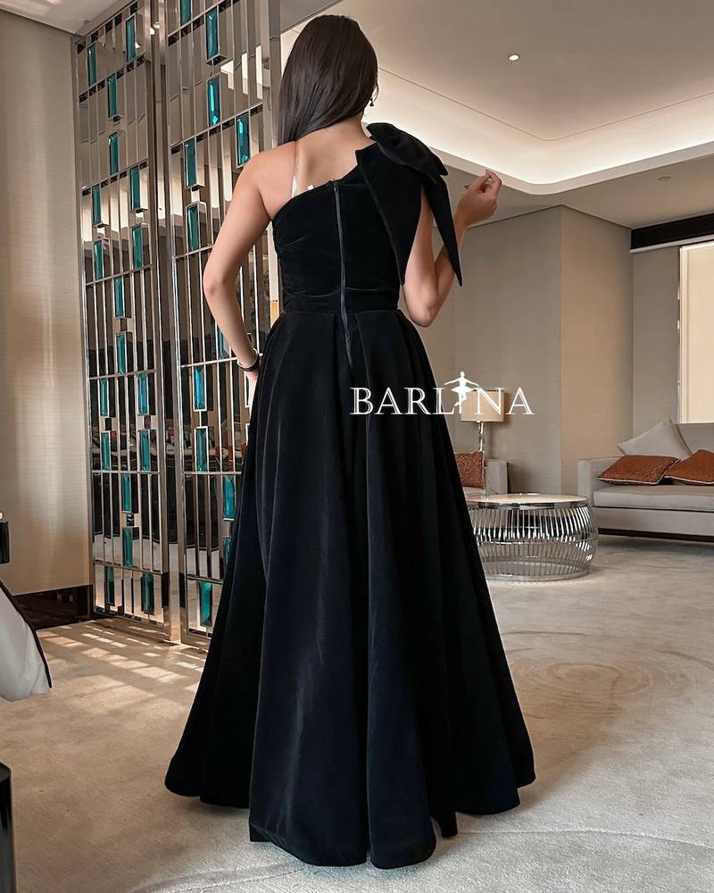 Black velvet dress with bow on the shoulder