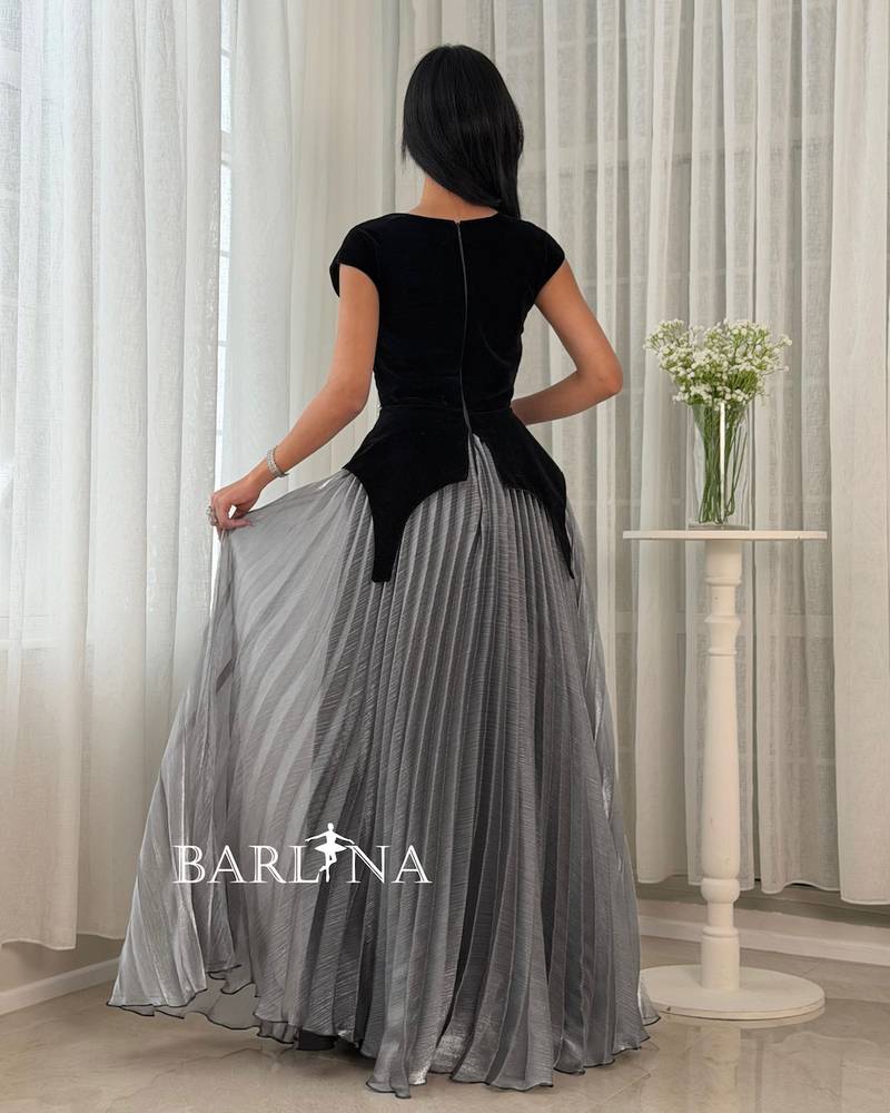 An elegant dress with a modern design and shimmering details