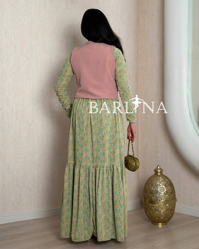 Green patterned jalabiya with a pink jacket
