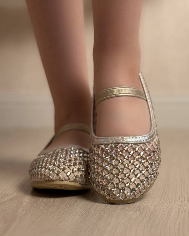 Soft girls' shoes adorned with sparkling crystals