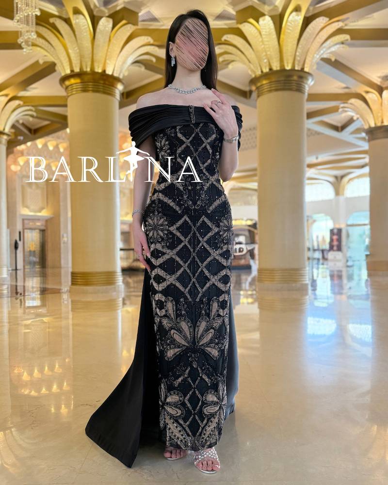 Black dress with shiny embroidery in geometric designs