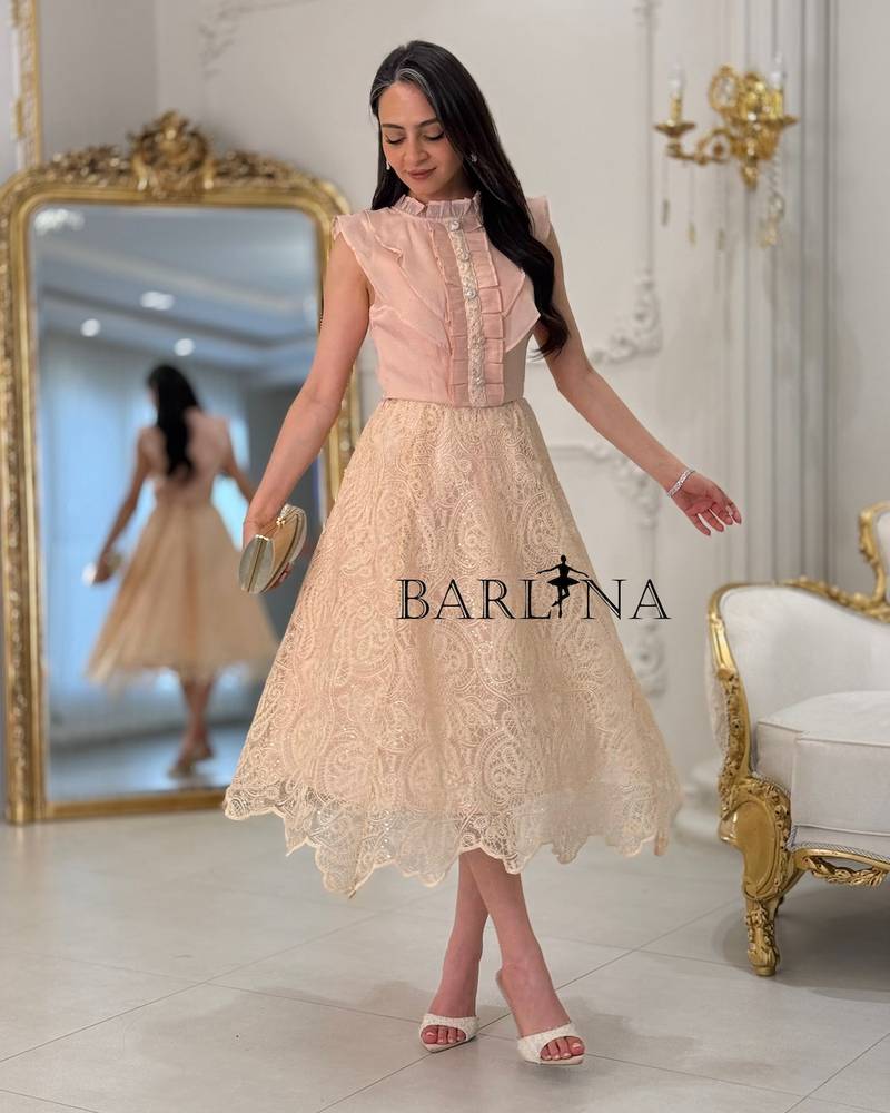 Feminine pink set with a scalloped-edge skirt