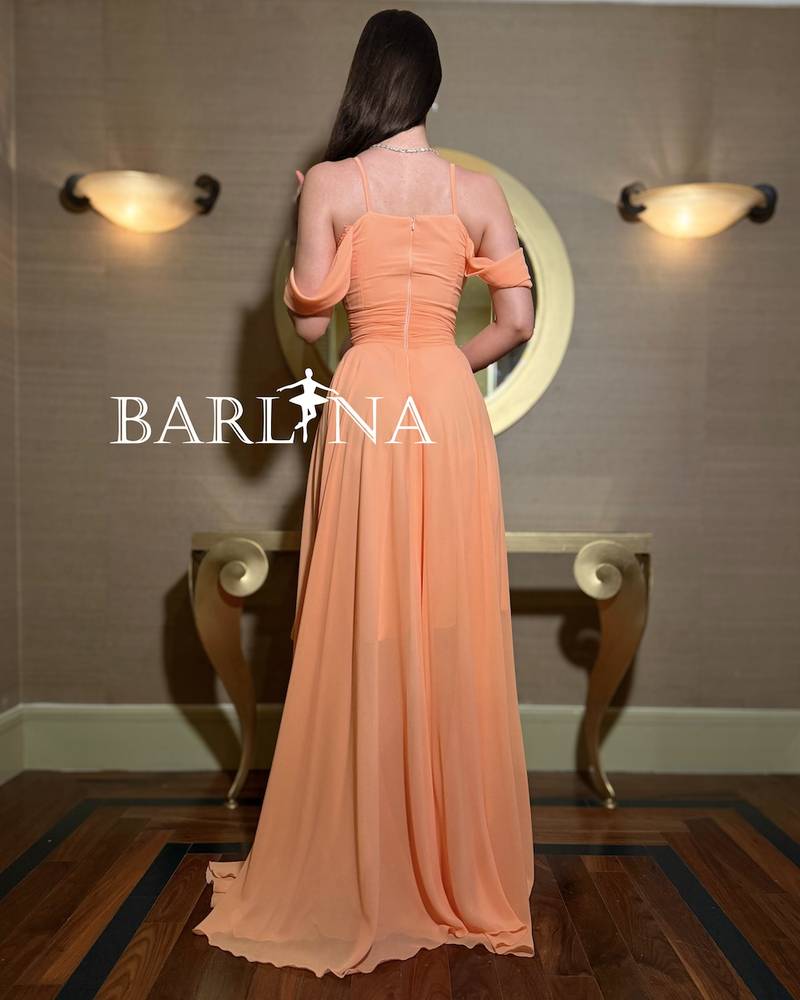 Soft melon dress with a high-low design