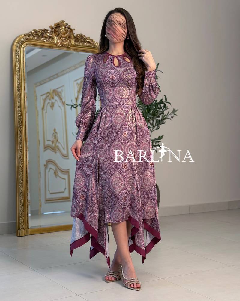 A purple patterned dress with an elegant tiered cut