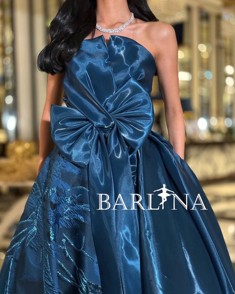 Petrol dress with front bow in shiny fabric