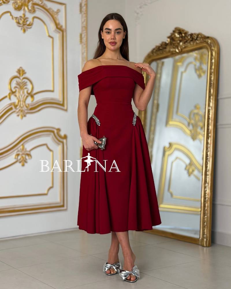 Burgundy off-shoulder dress with a feminine cut