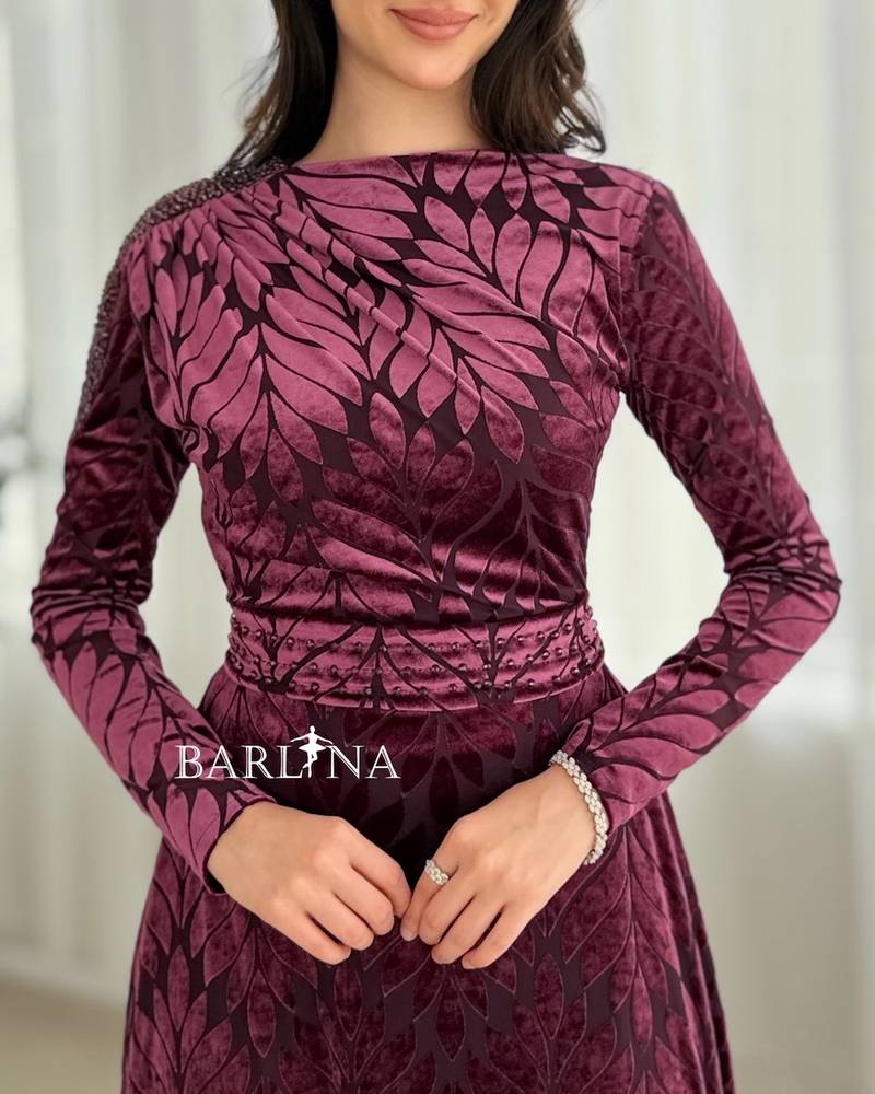 Burgundy dress with one shoulder adorned with crystal beads