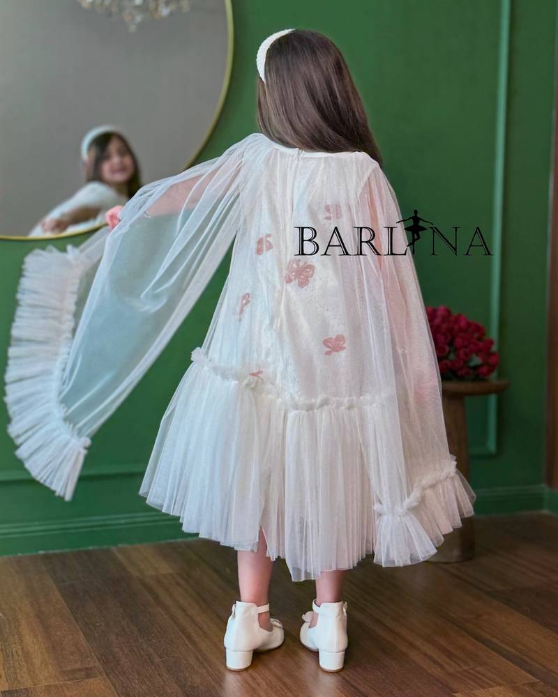 white girl's dress with wide tulle sleeves