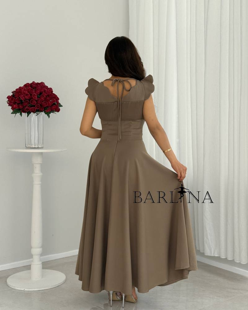 A soft, mocha-colored dress with a wide, embellished cut
