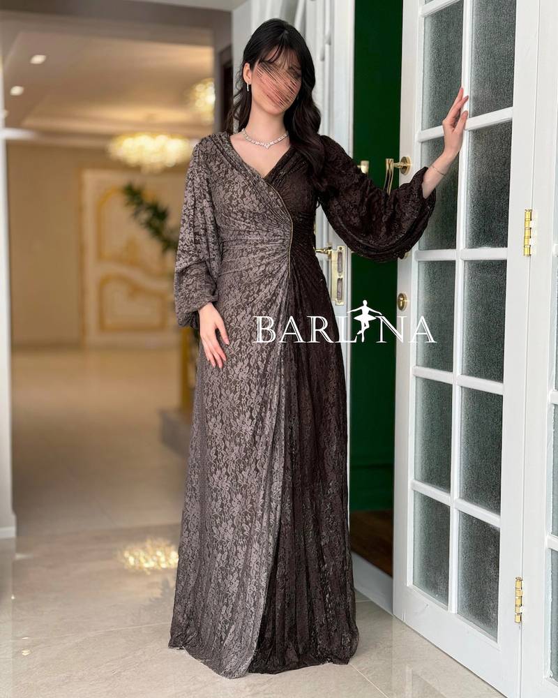 Luxurious brown dress with a draped wrap design