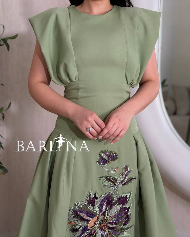 Olive green dress with a flower embroidery in the center