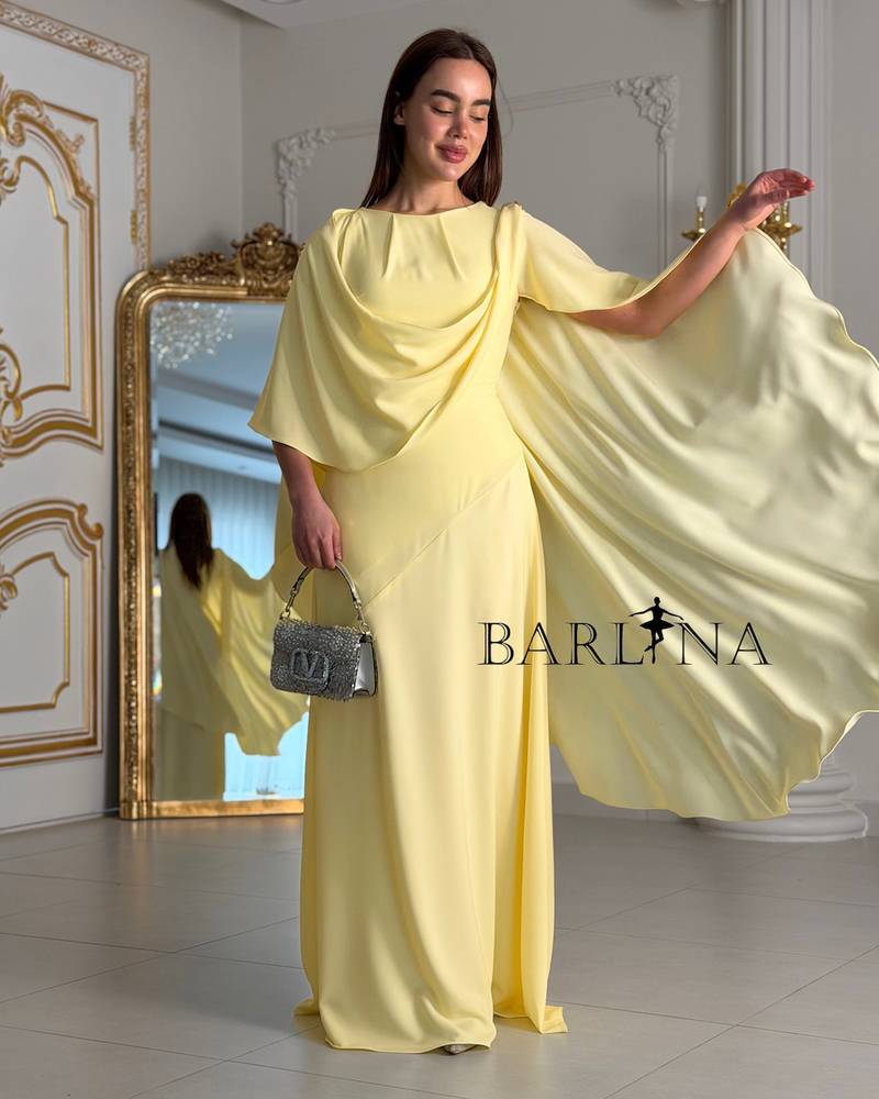 Soft yellow dress with a wide cape