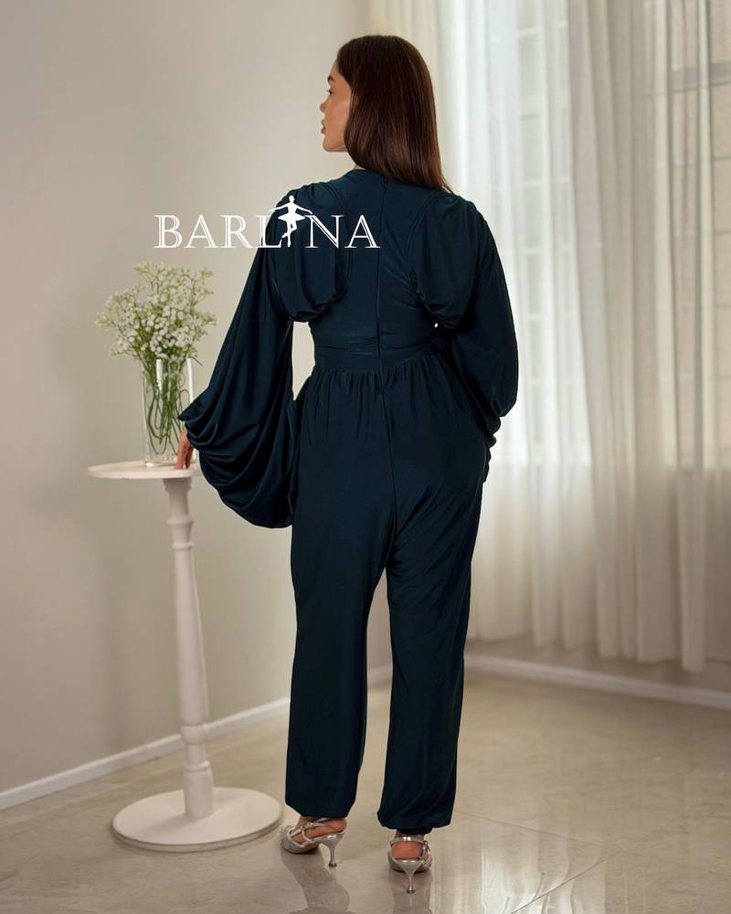 Navy jumpsuit with wide sleeves and a defined waist