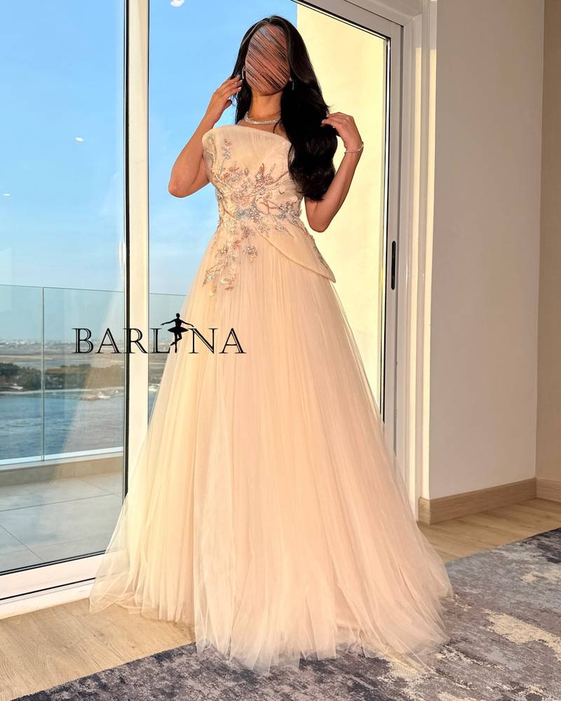 Light beige dress with intricate floral embroidery
