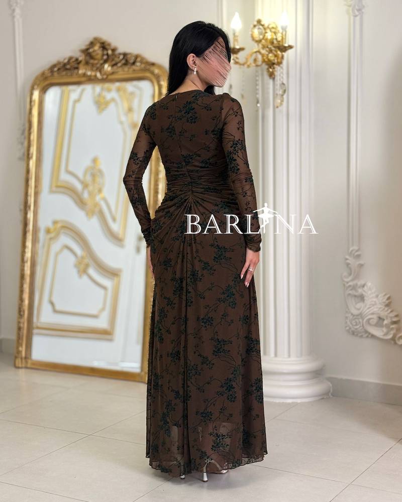 Elegant long dress with embellished sheer fabric