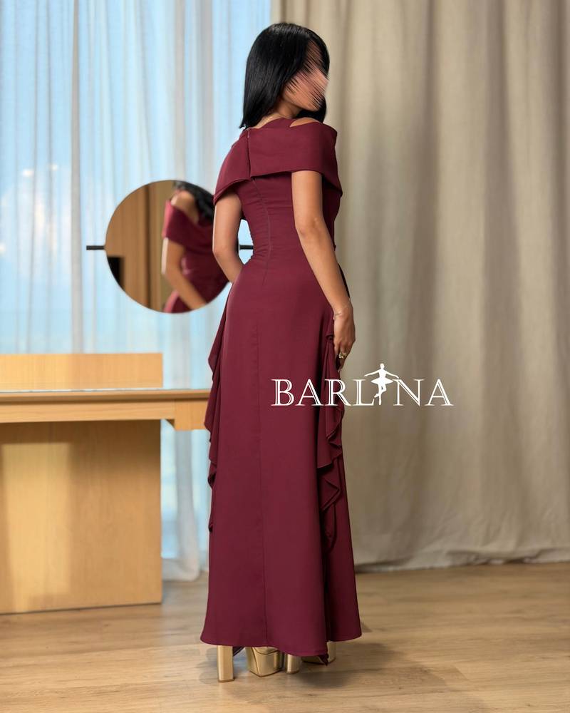 A soft burgundy dress with elegant side ruffles