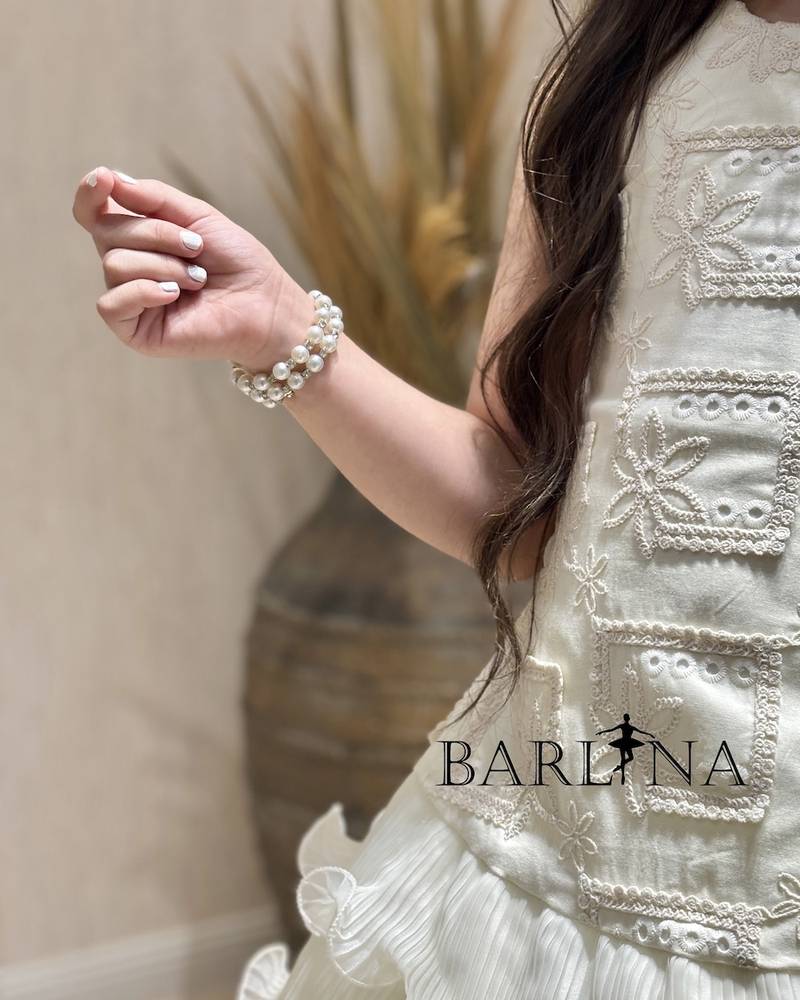 Ivory girls' dress with short ruffled layers