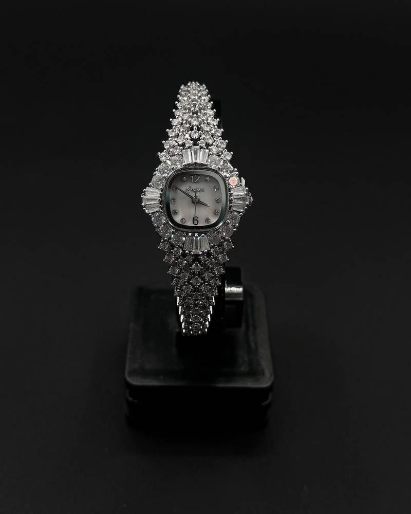 A luxury wristwatch fully encrusted with sparkling stones
