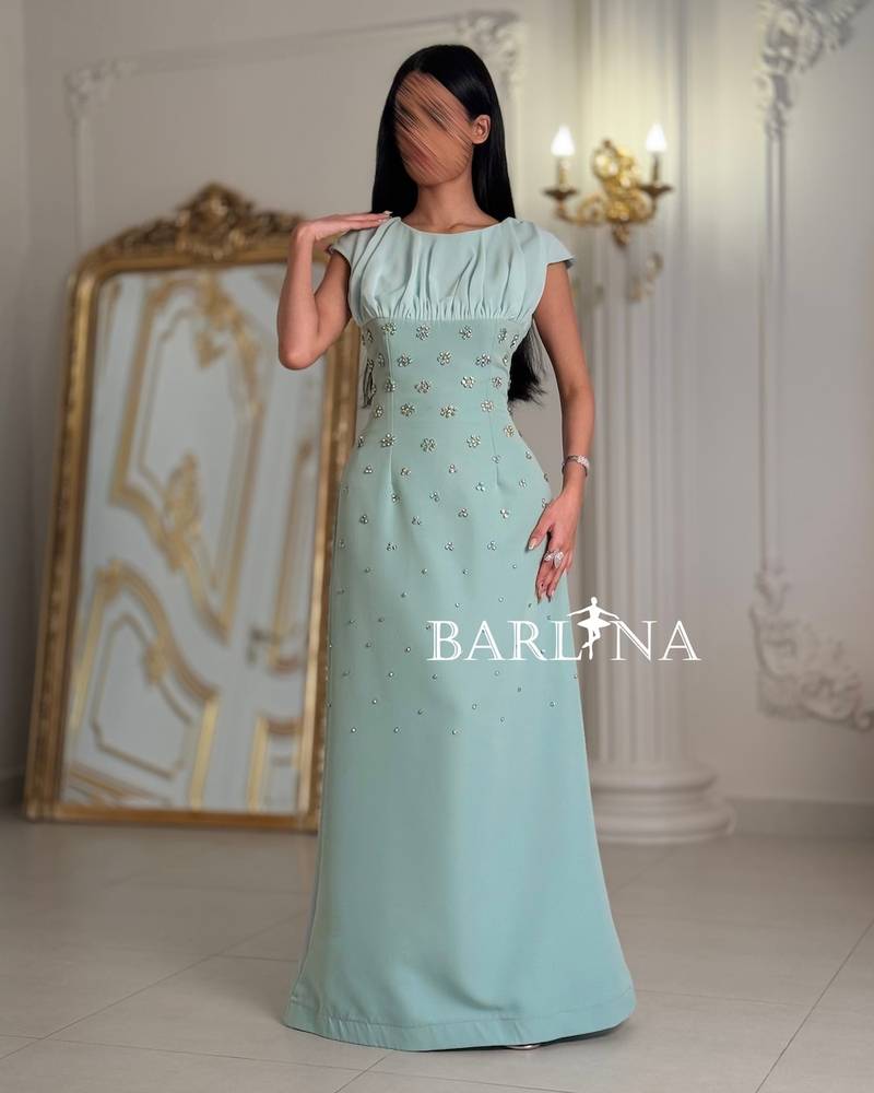 Occasion dress with a fitted waist and scattered crystals