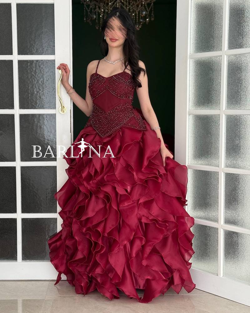 Burgundy evening dress with multiple ruffle layers