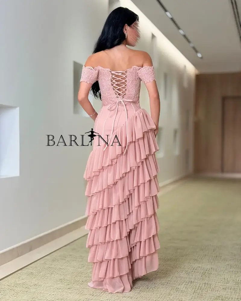 A pink dress with soft ruffles and a touch of lace.