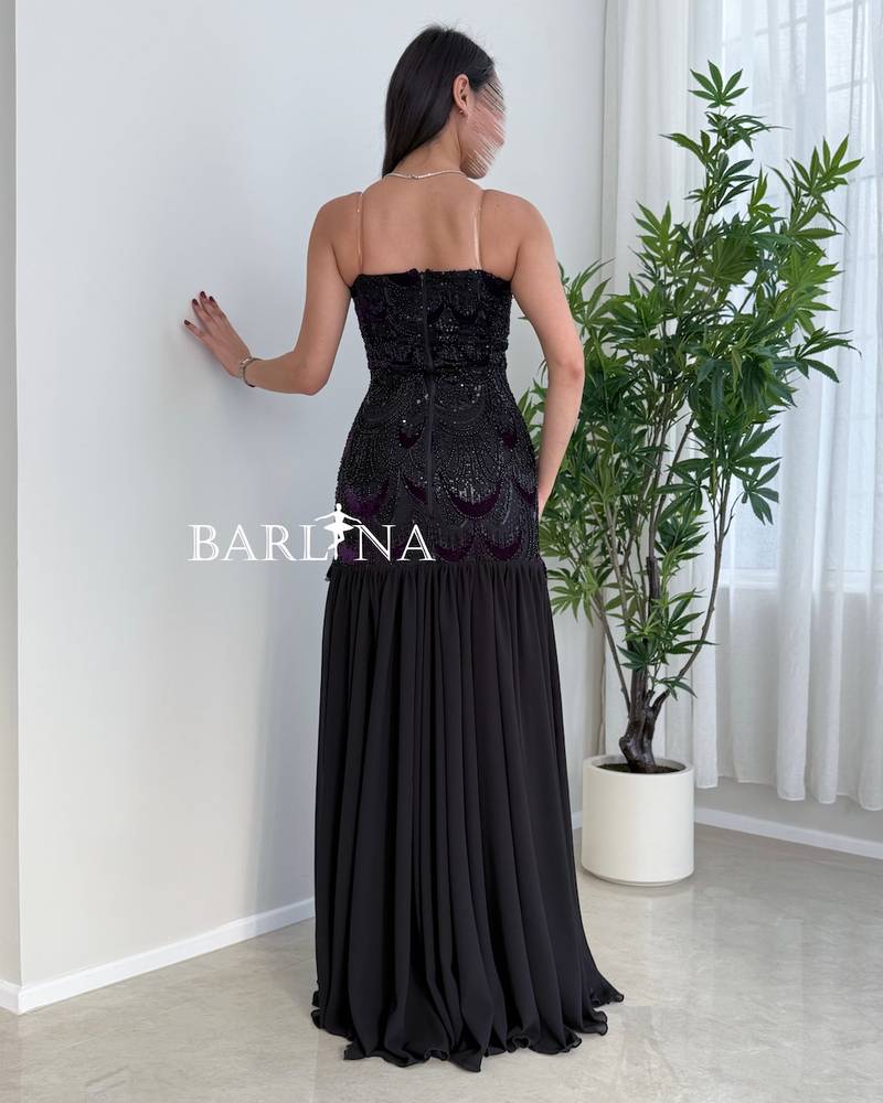 Black dress with a sequined embroidered sweetheart neckline
