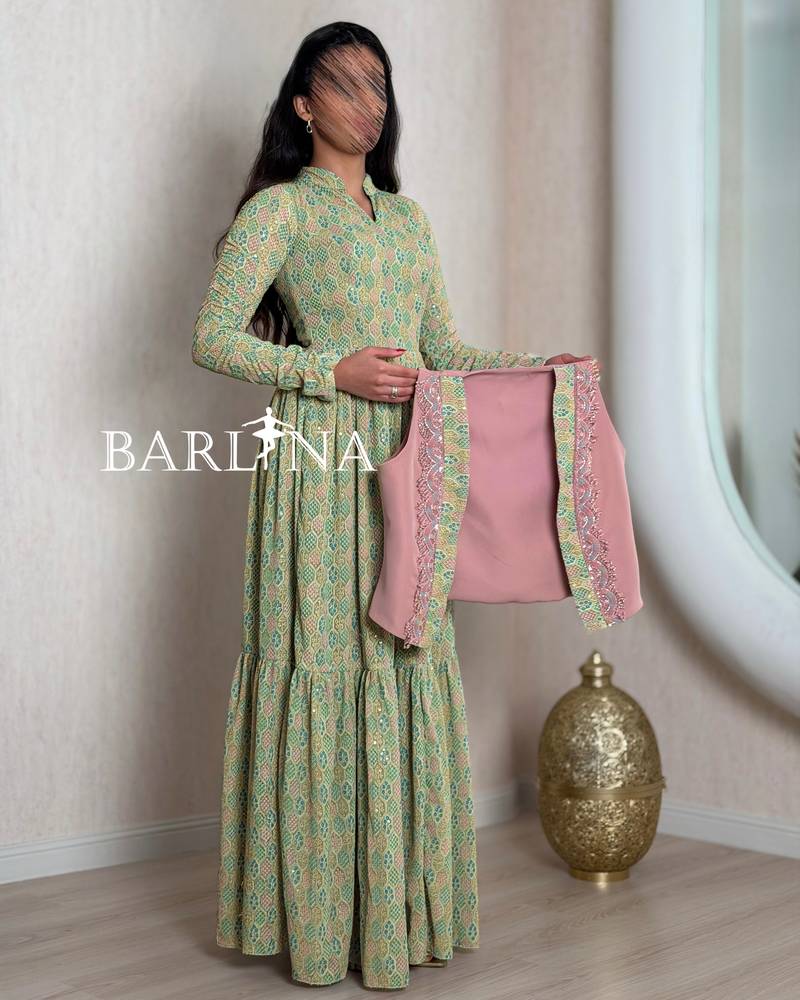 Green patterned jalabiya with a pink jacket
