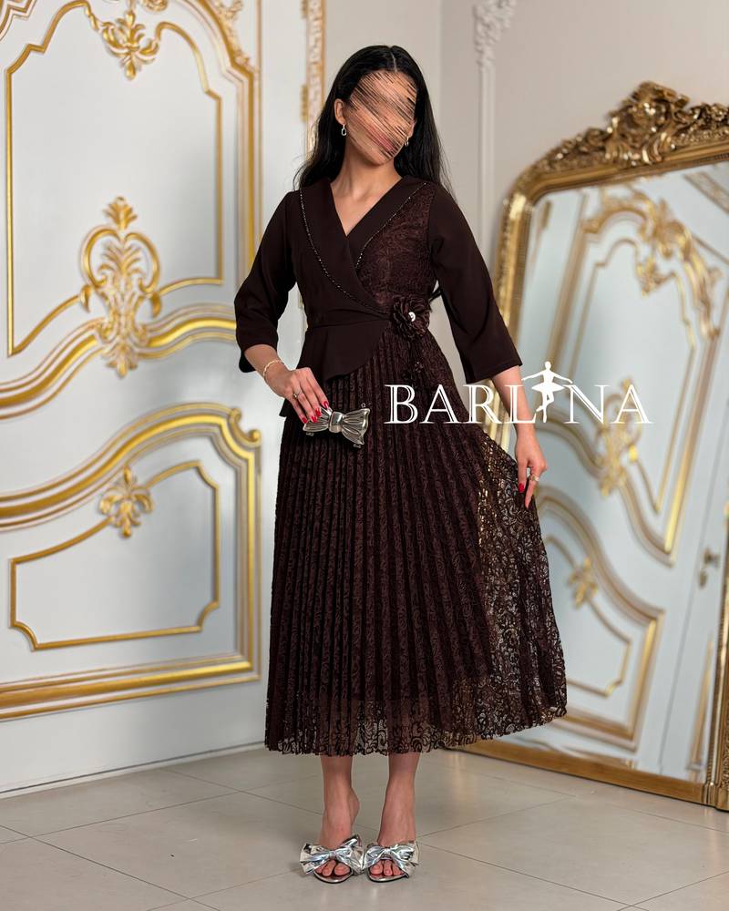 Brown lace dress with a rose detail at the waist