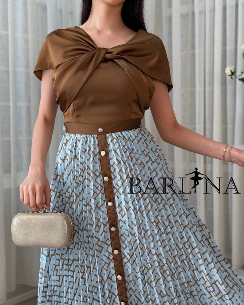 Women's set with a light blue pleated skirt and a brown blouse