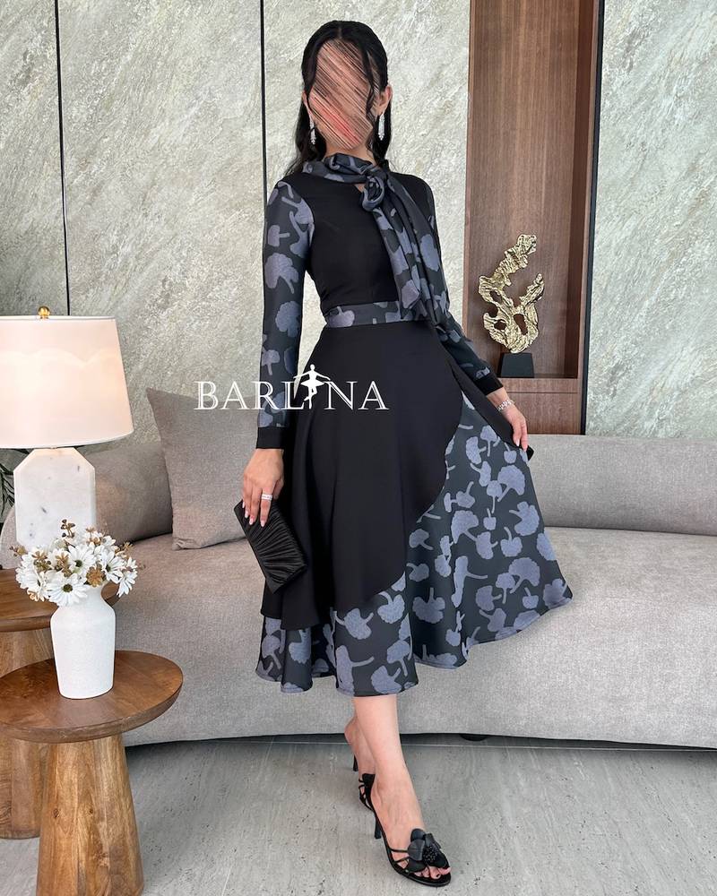 فستان أسود ميد بأطراف مشجرة
