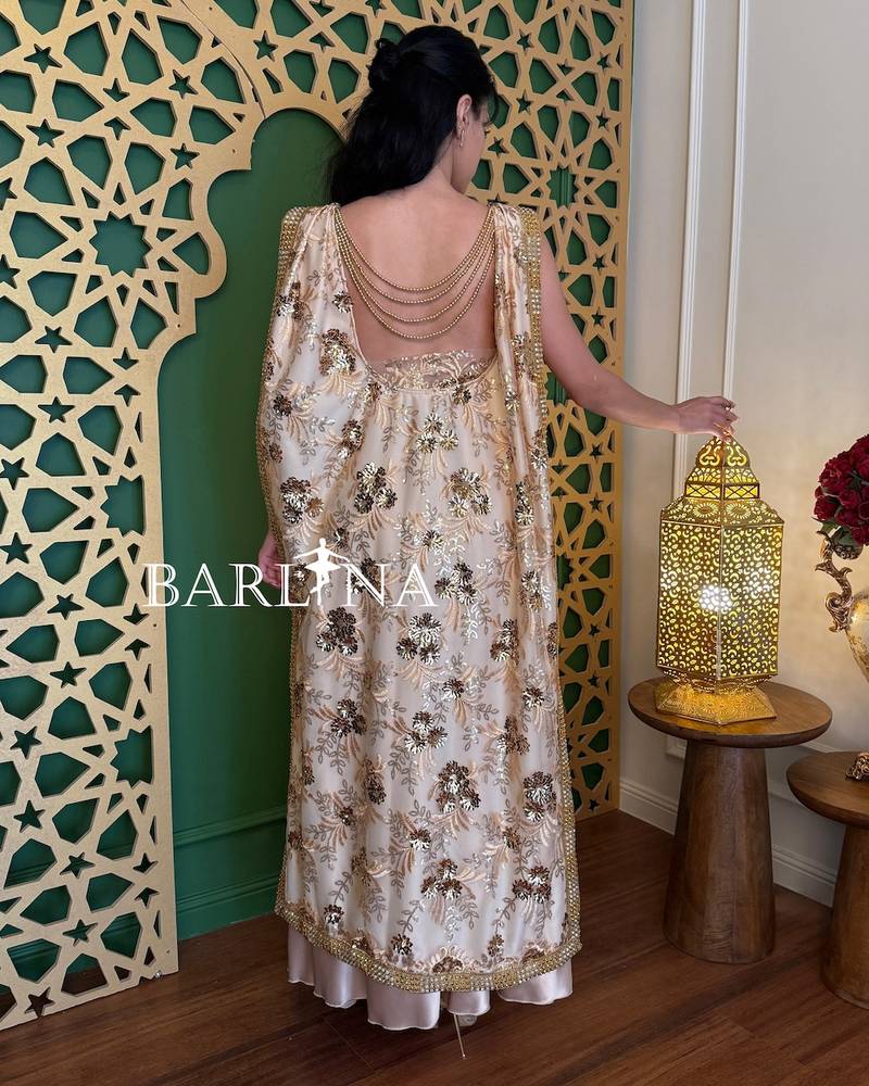 Beige open-back dress with chains