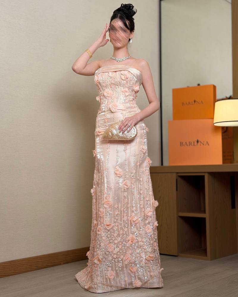 Elegant peach evening dress with an open neckline