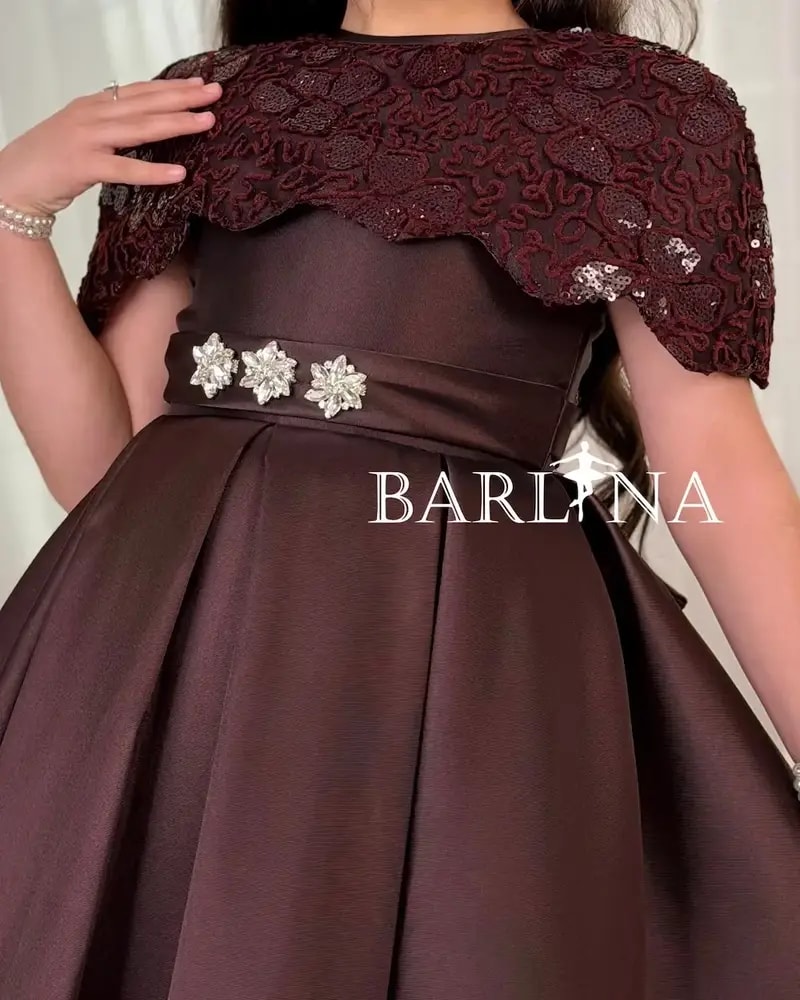 Elegant girls' dress with embellished shoulders