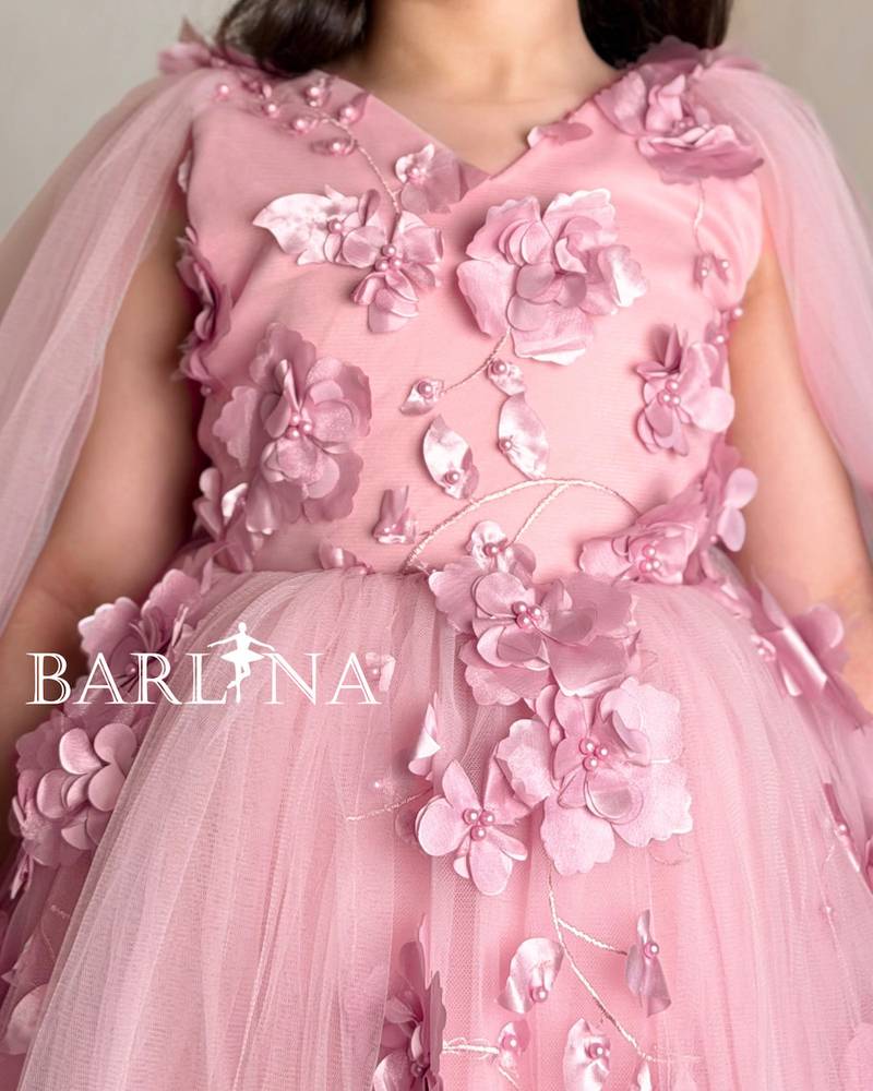 Pink girl's dress with rose details and tulle layers