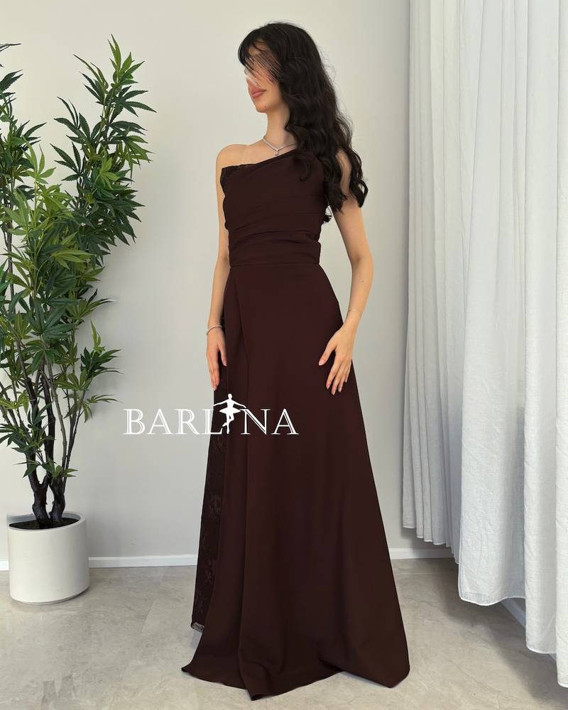 Brown dress with an open neckline and lace details