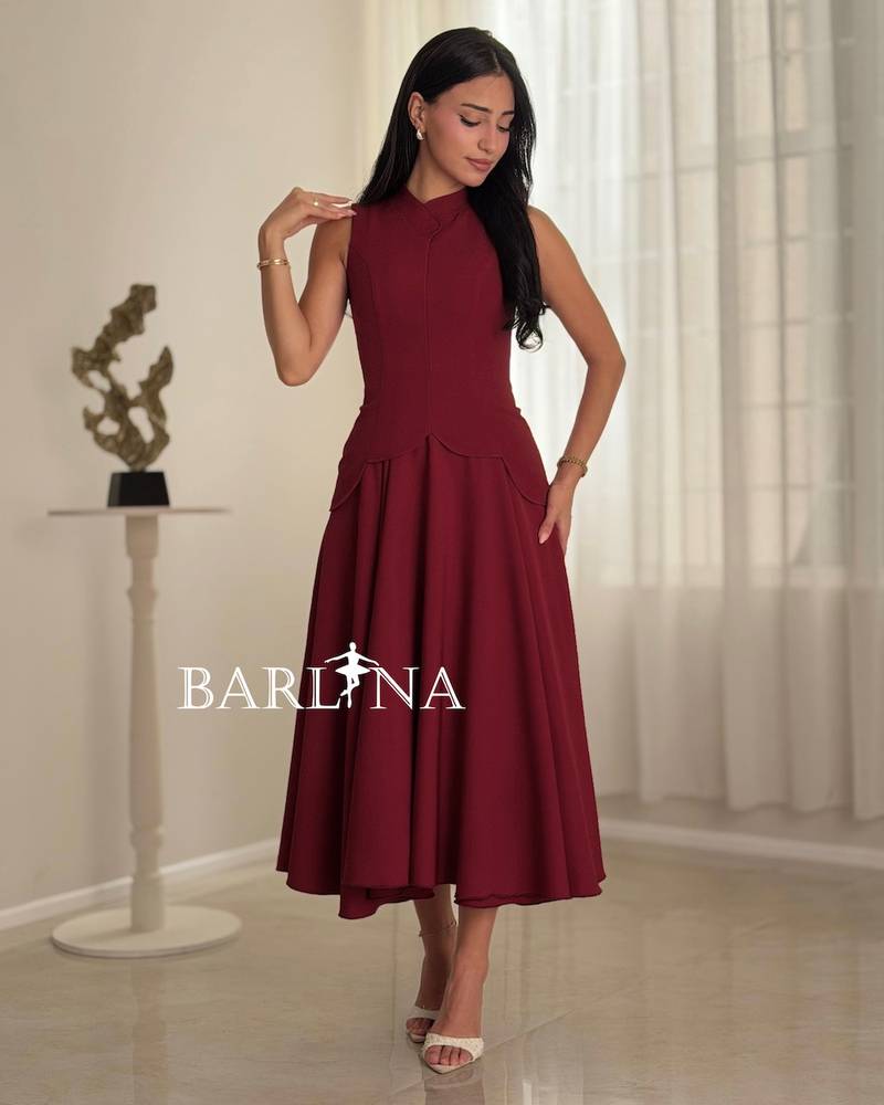 A burgundy dress with a defined waist