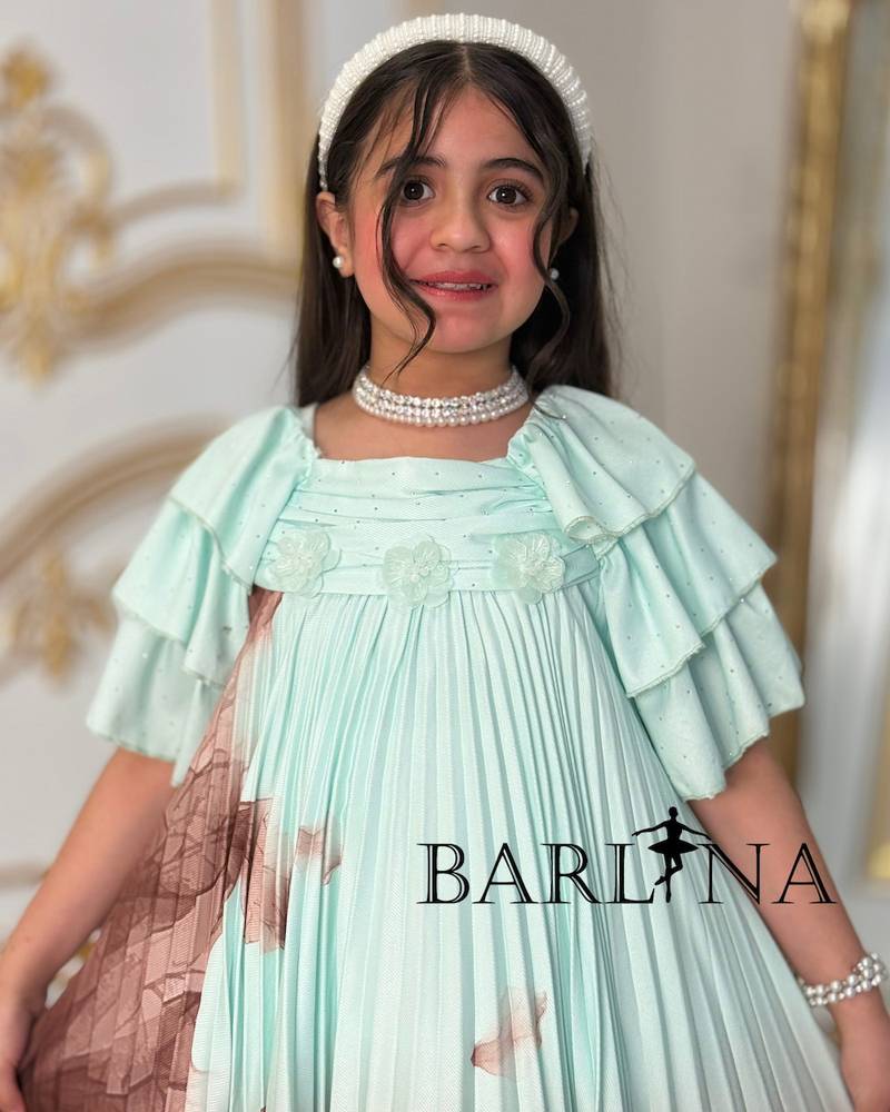 A soft girl's dress decorated with delicate prints