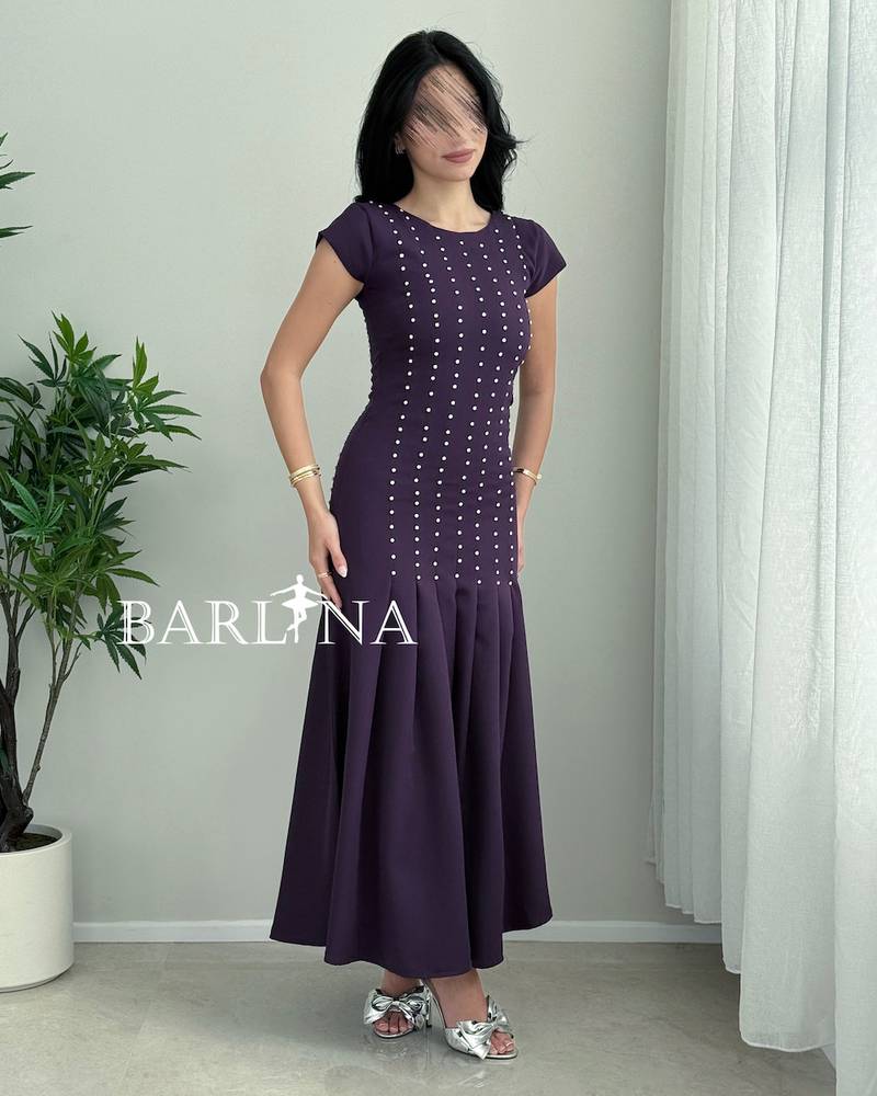 A soft purple dress with small polka dot embroidery